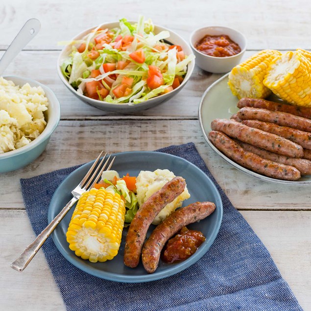 Pork and Herb Sausages with Grilled Corn and Smashed Potatoes