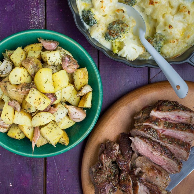 Butterflied Lamb with Garlic Roast Potatoes and Cauliflower Broccoli Cheese