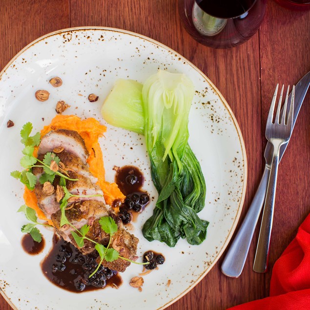 Crispy Duck Breast with Kumara Mash, Bok Choy and Chinese-Spiced Blueberry Sauce